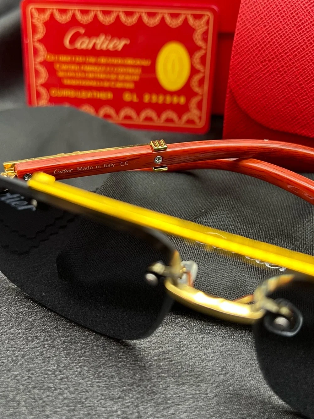 Cartier Men’s Black and Gold Rimless Sunglasses